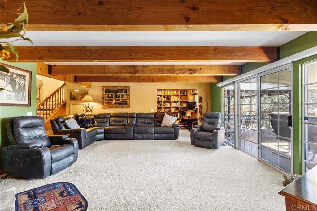 10499 Highway 79 Descanso, CA 91916 - Photo 25 of 75 a living room with furniture and a floor to ceiling window