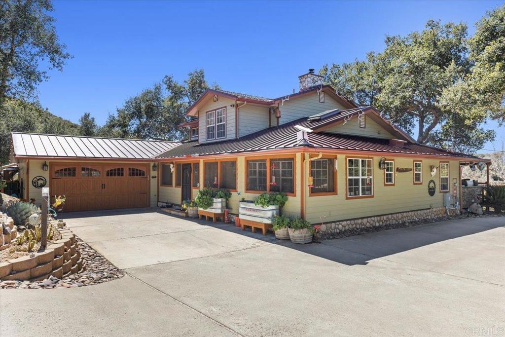 10499 Highway 79 Descanso, CA 91916 - Photo 3 of 75 a front view of a house with a yard and garage