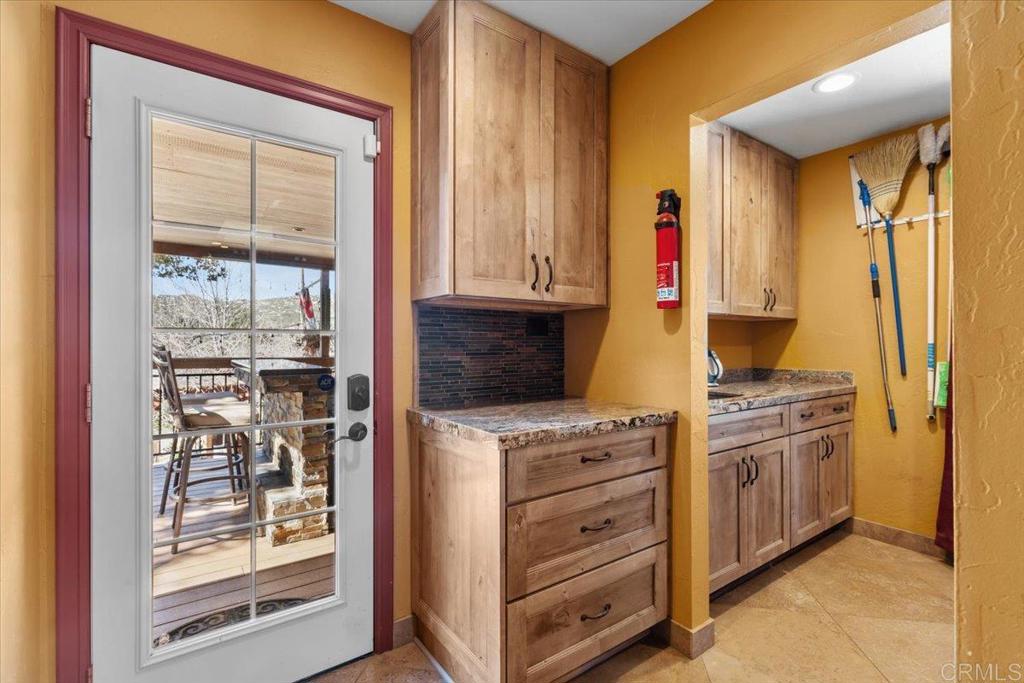 10499 Highway 79 Descanso, CA 91916 - Photo 33 of 75 a kitchen with stainless steel appliances granite countertop a stove and a refrigerator