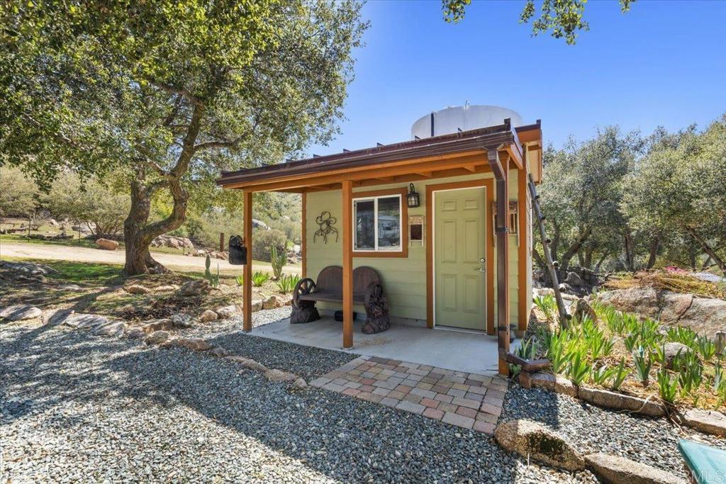 10499 Highway 79 Descanso, CA 91916 - Photo 44 of 75 a view of a house with backyard and a tree