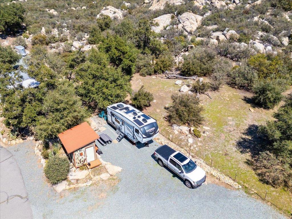 10499 Highway 79 Descanso, CA 91916 - Photo 68 of 75 an aerial view of a residential house with yard and parking space