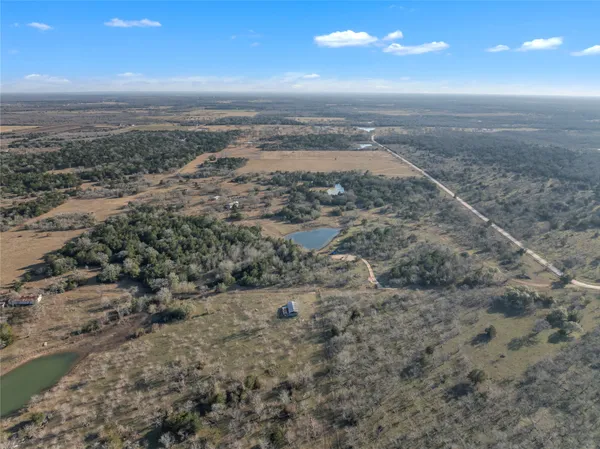 a view of a beach with a city view