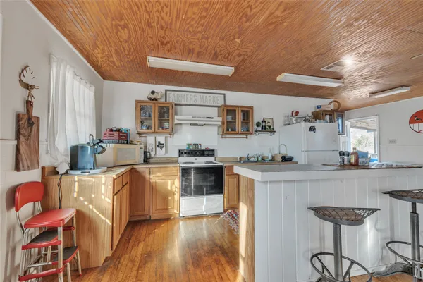 a kitchen with stainless steel appliances granite countertop a stove and cabinets