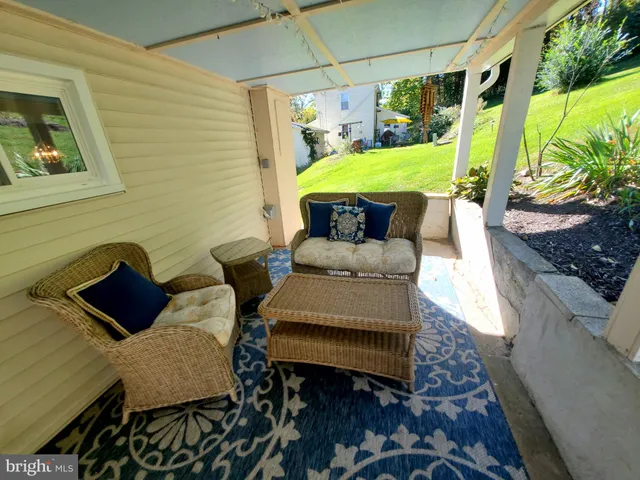 a outdoor living space with furniture and garden view