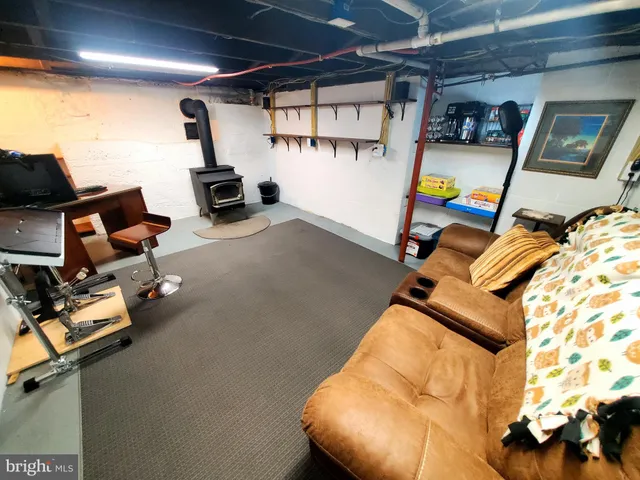 a view of gym equipment with wooden floor