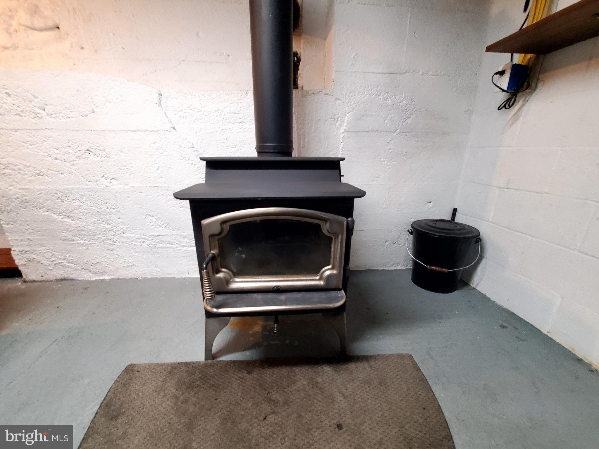 311 Lyonstown Road Bellefonte, PA 16823 - Photo 13 of 43 a living room with a couch and a fireplace
