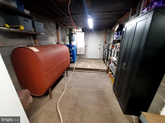 a view of a porch with furniture and a garage