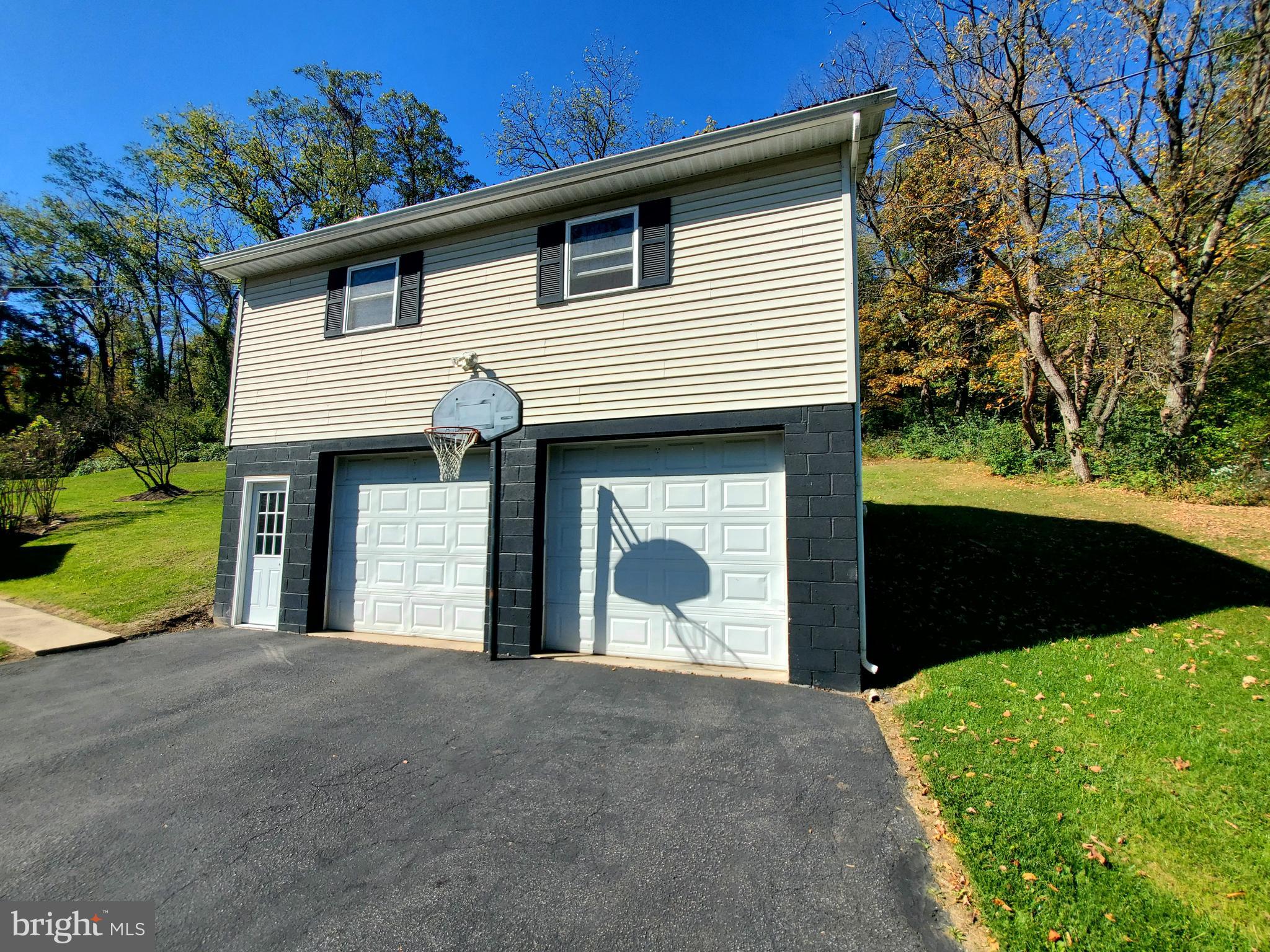 311 Lyonstown Road Bellefonte, PA 16823 - Photo 2 of 43 a front view of a house with a yard and garage