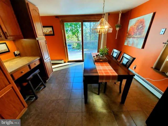 a view of a living room with furniture and a flat screen tv