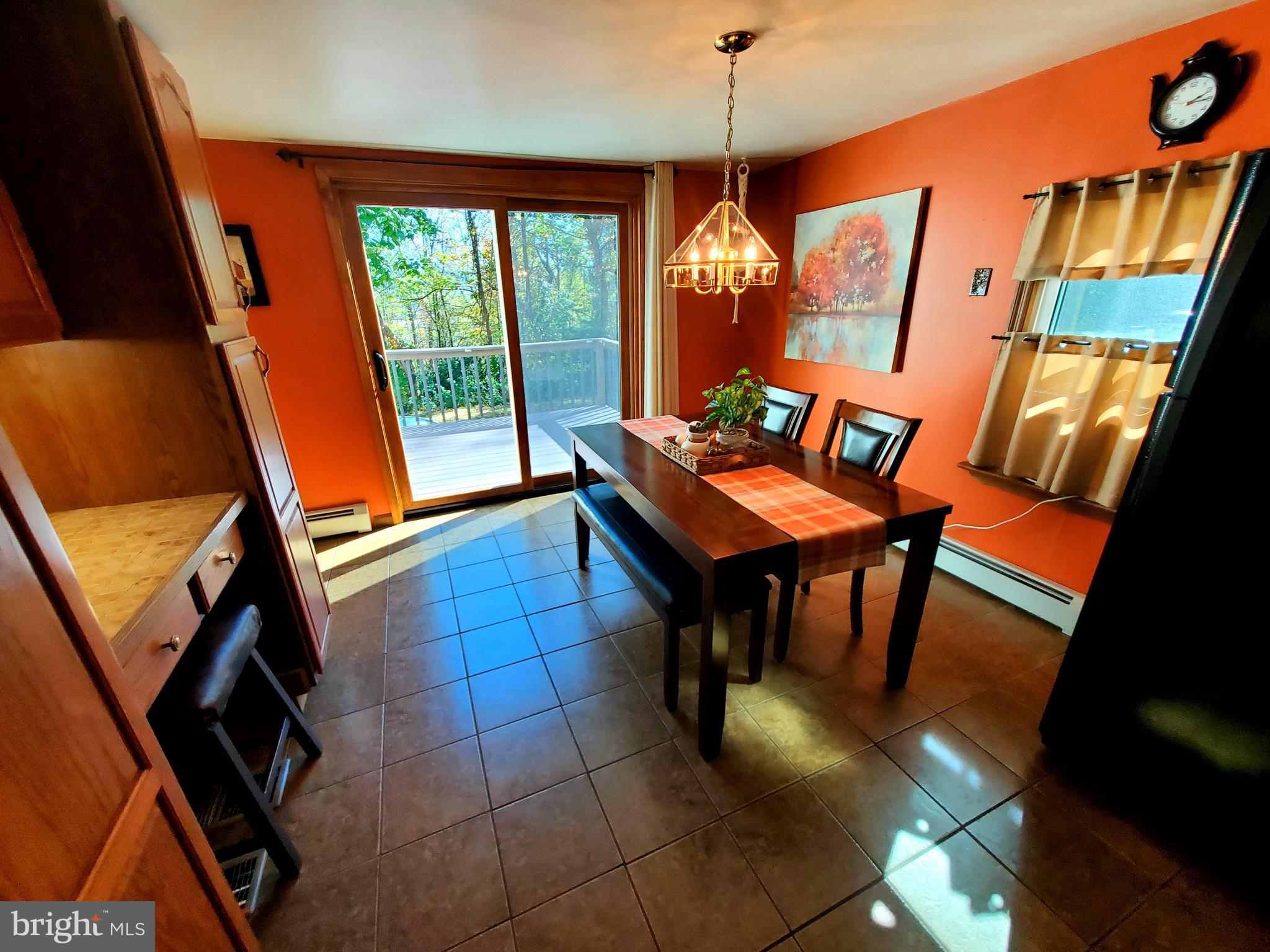 311 Lyonstown Road Bellefonte, PA 16823 - Photo 22 of 43 a view of a dining room with furniture window and wooden floor