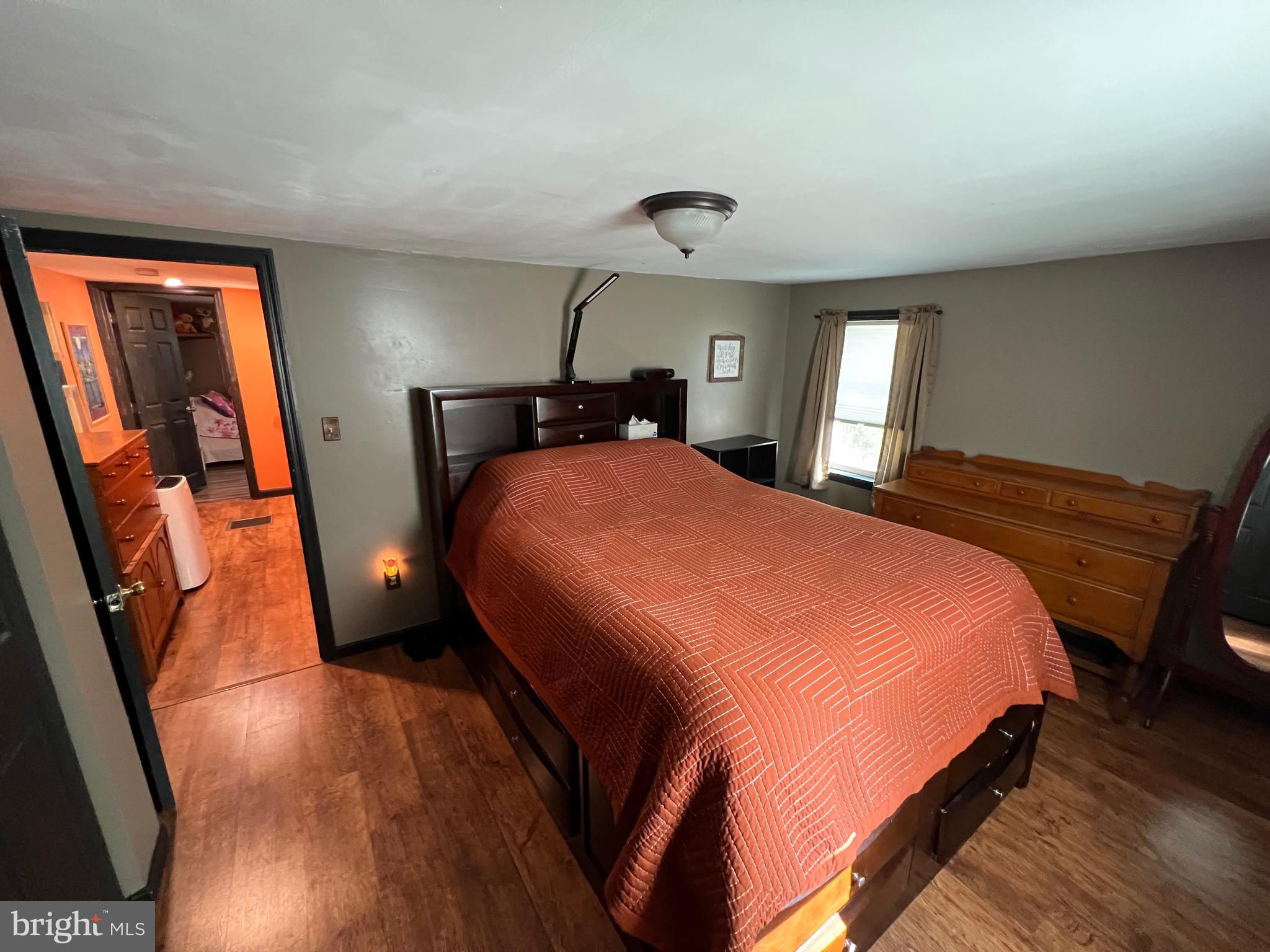 311 Lyonstown Road Bellefonte, PA 16823 - Photo 33 of 43 a bedroom with a bed and large windows