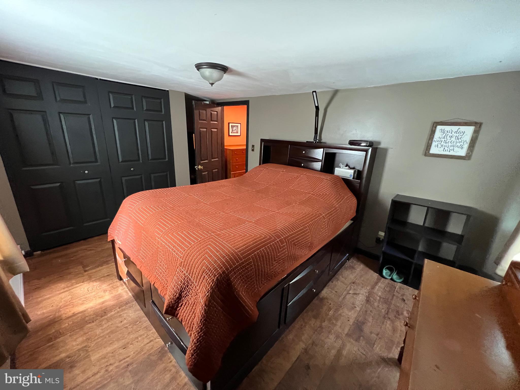 311 Lyonstown Road Bellefonte, PA 16823 - Photo 34 of 43 a bed sitting in a bedroom and a mirror