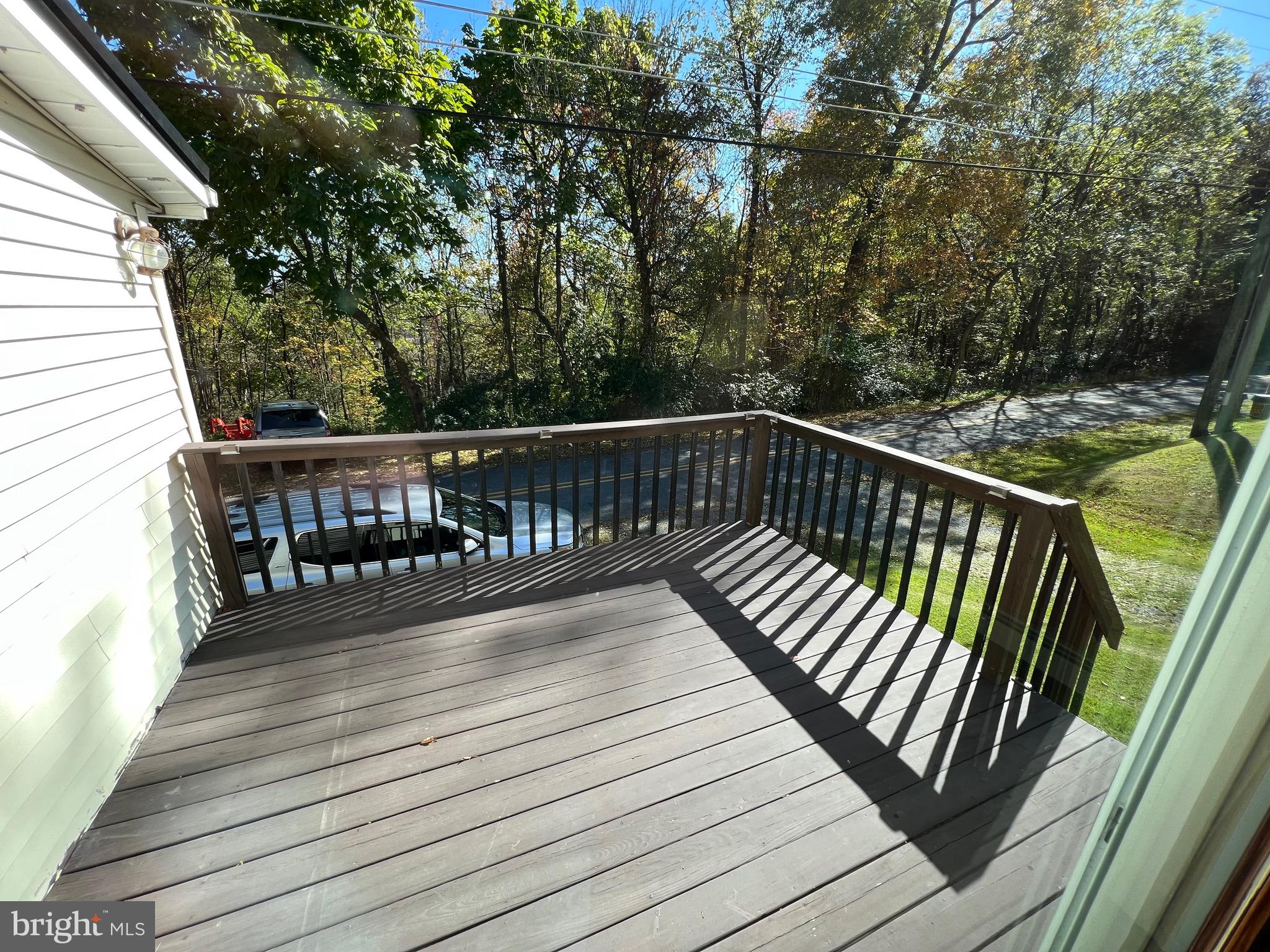 311 Lyonstown Road Bellefonte, PA 16823 - Photo 39 of 43 a balcony with wooden floor and fence