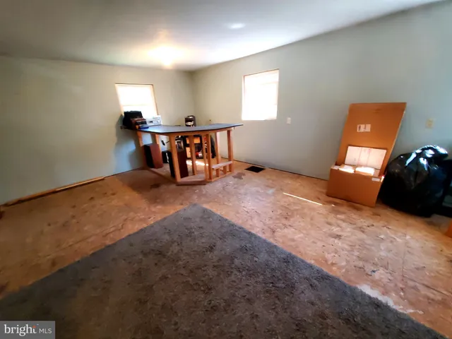 wooden floor and a projector in a room