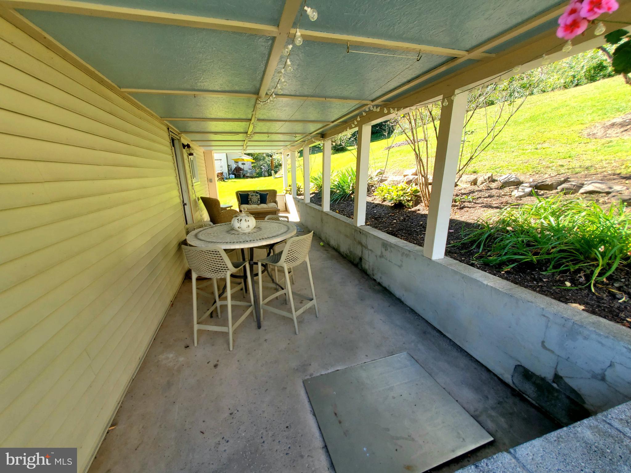 311 Lyonstown Road Bellefonte, PA 16823 - Photo 9 of 43 a dining room with furniture and a garden