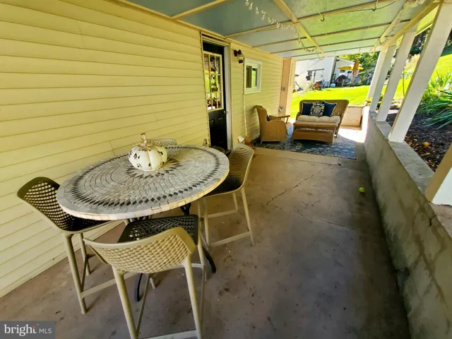 a outdoor dining space with furniture