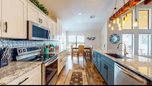 a kitchen with granite countertop lots of counter top space