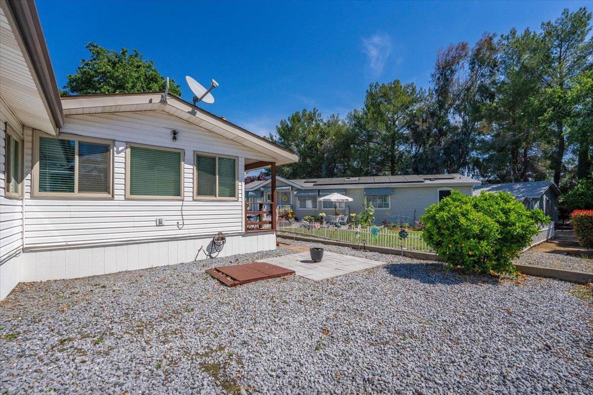 350 Gilmore Road Red Bluff, CA 96080 - Photo 26 of 27 a backyard of a house with lots of green space