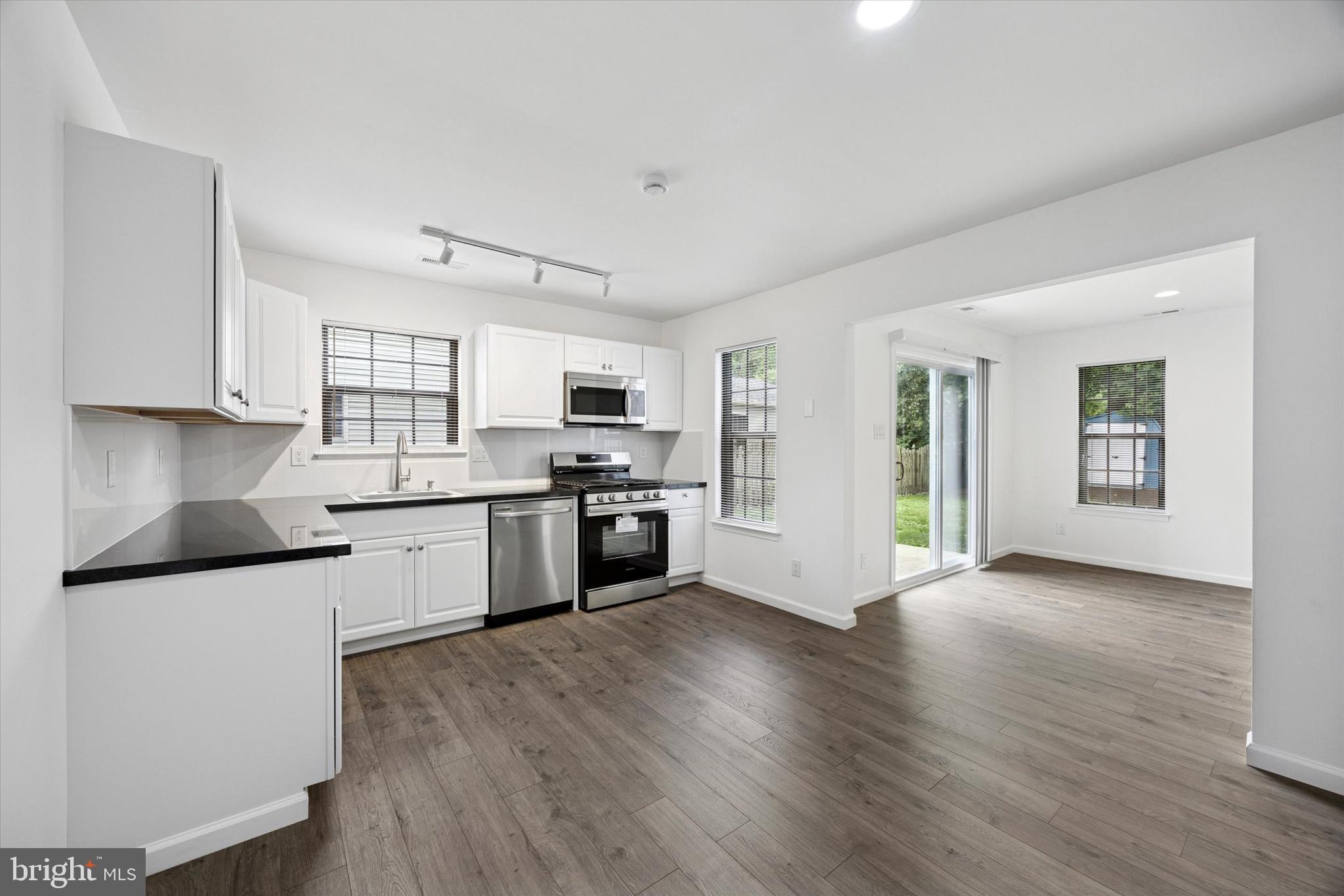 532 Cormorant Drive Voorhees, NJ 08043 - Photo 12 of 25 a kitchen with granite countertop a stove top oven and cabinets