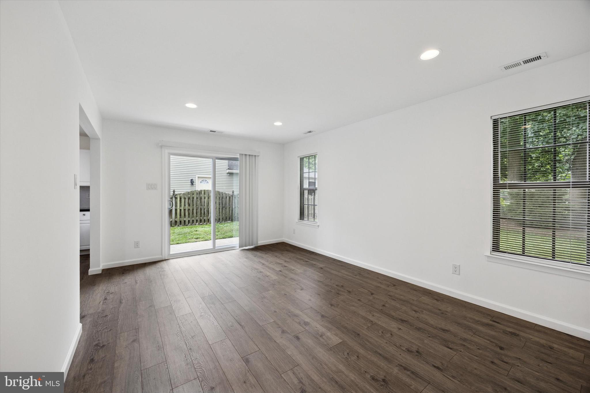 532 Cormorant Drive Voorhees, NJ 08043 - Photo 13 of 25 a view of an empty room with wooden floor and a window