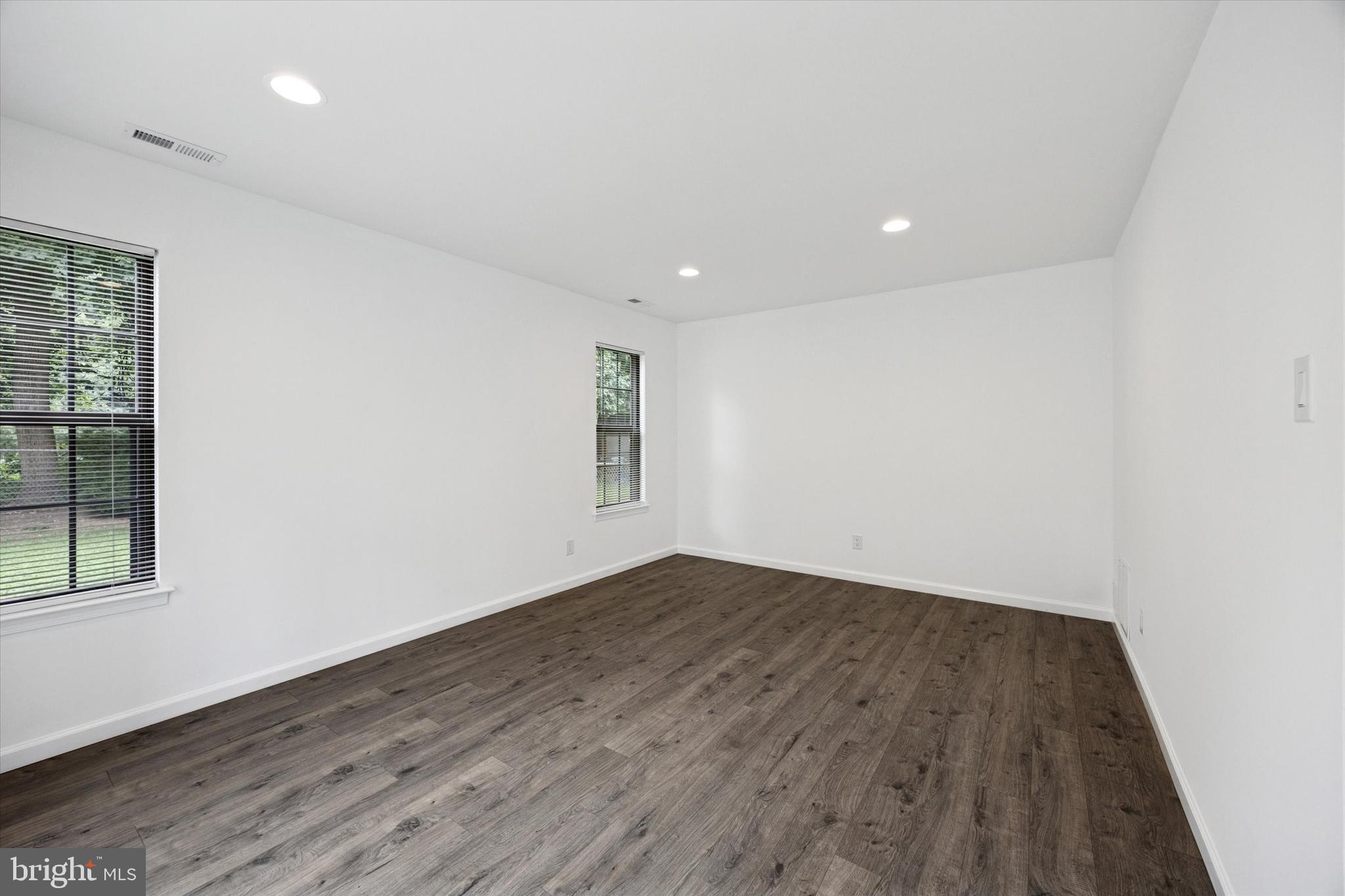 532 Cormorant Drive Voorhees, NJ 08043 - Photo 15 of 25 an empty room with wooden floor and windows
