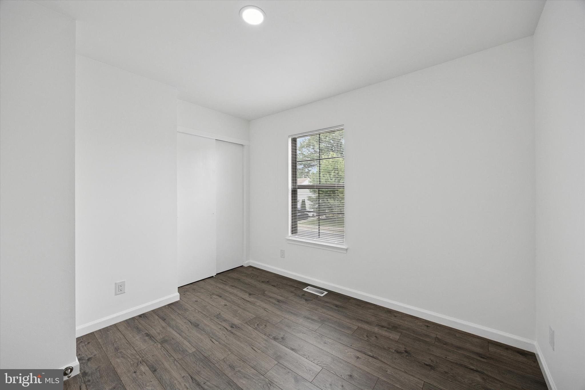 532 Cormorant Drive Voorhees, NJ 08043 - Photo 16 of 25 an empty room with wooden floor and windows