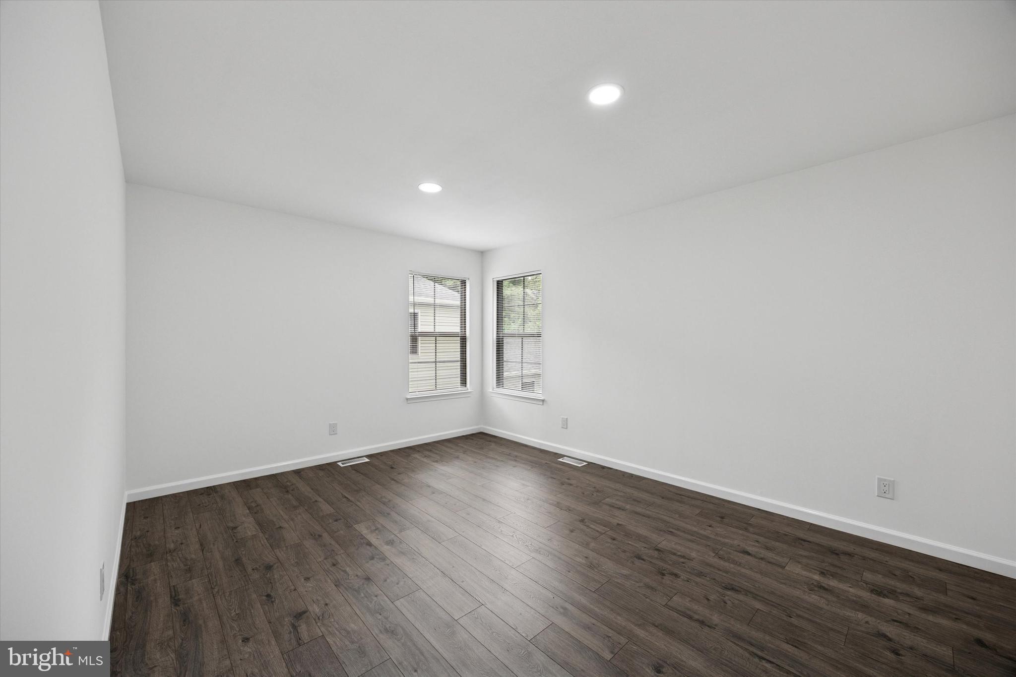 532 Cormorant Drive Voorhees, NJ 08043 - Photo 17 of 25 a view of an empty room with wooden floor and a window