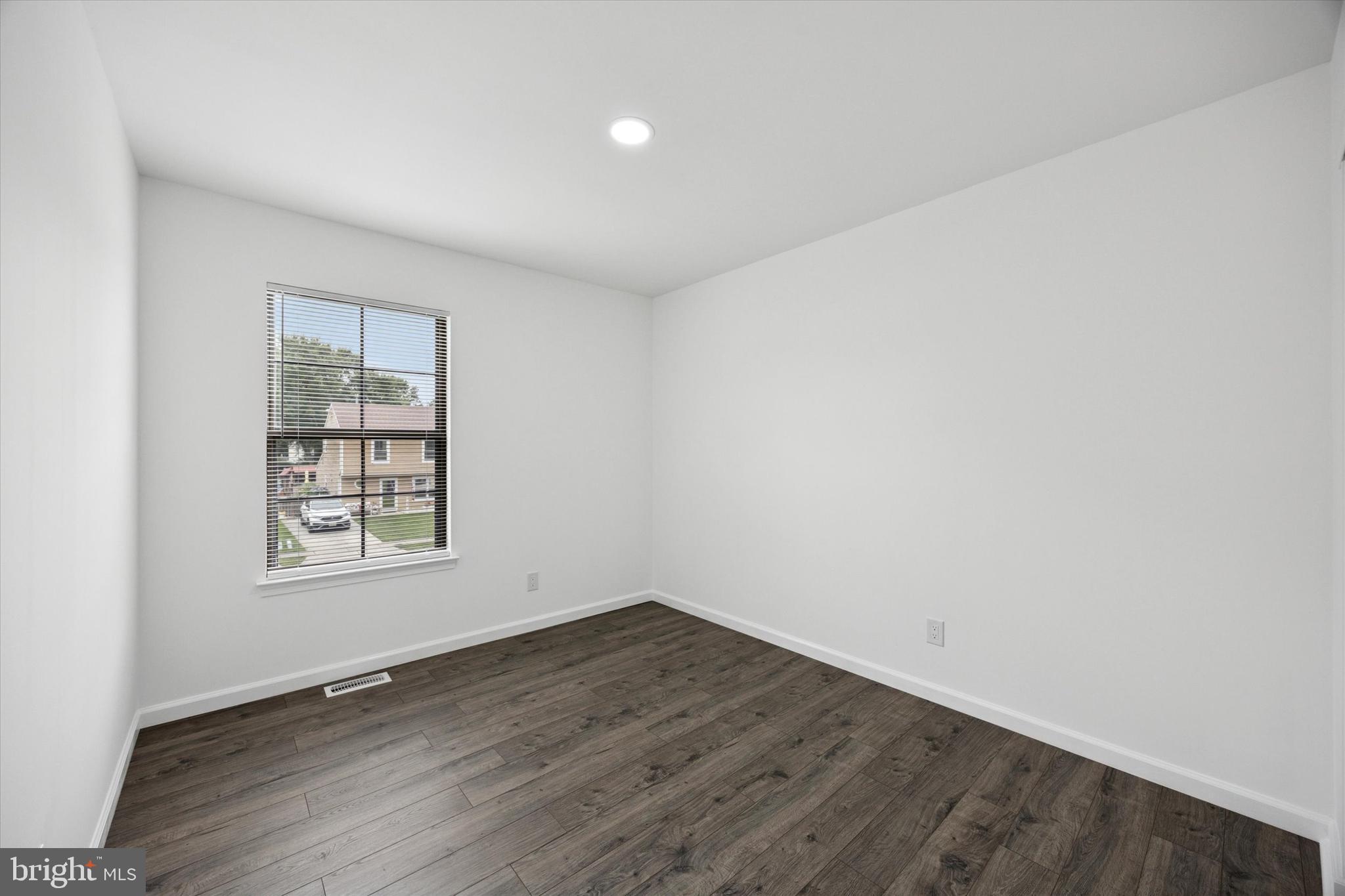 532 Cormorant Drive Voorhees, NJ 08043 - Photo 19 of 25 an empty room with wooden floor and windows