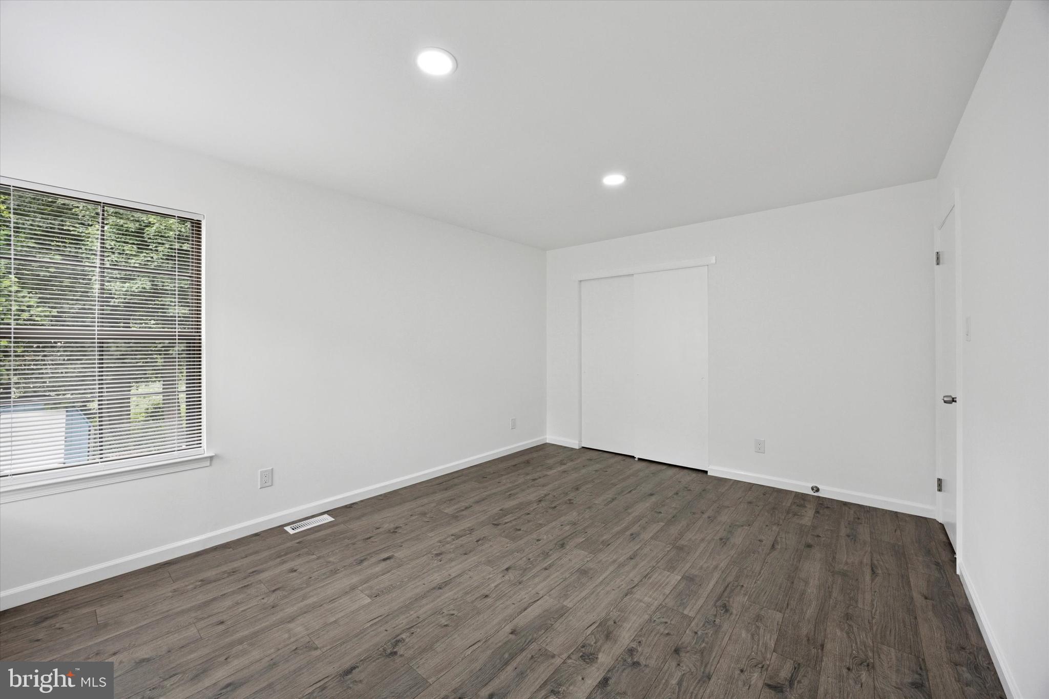 532 Cormorant Drive Voorhees, NJ 08043 - Photo 20 of 25 a view of an empty room with wooden floor and a window