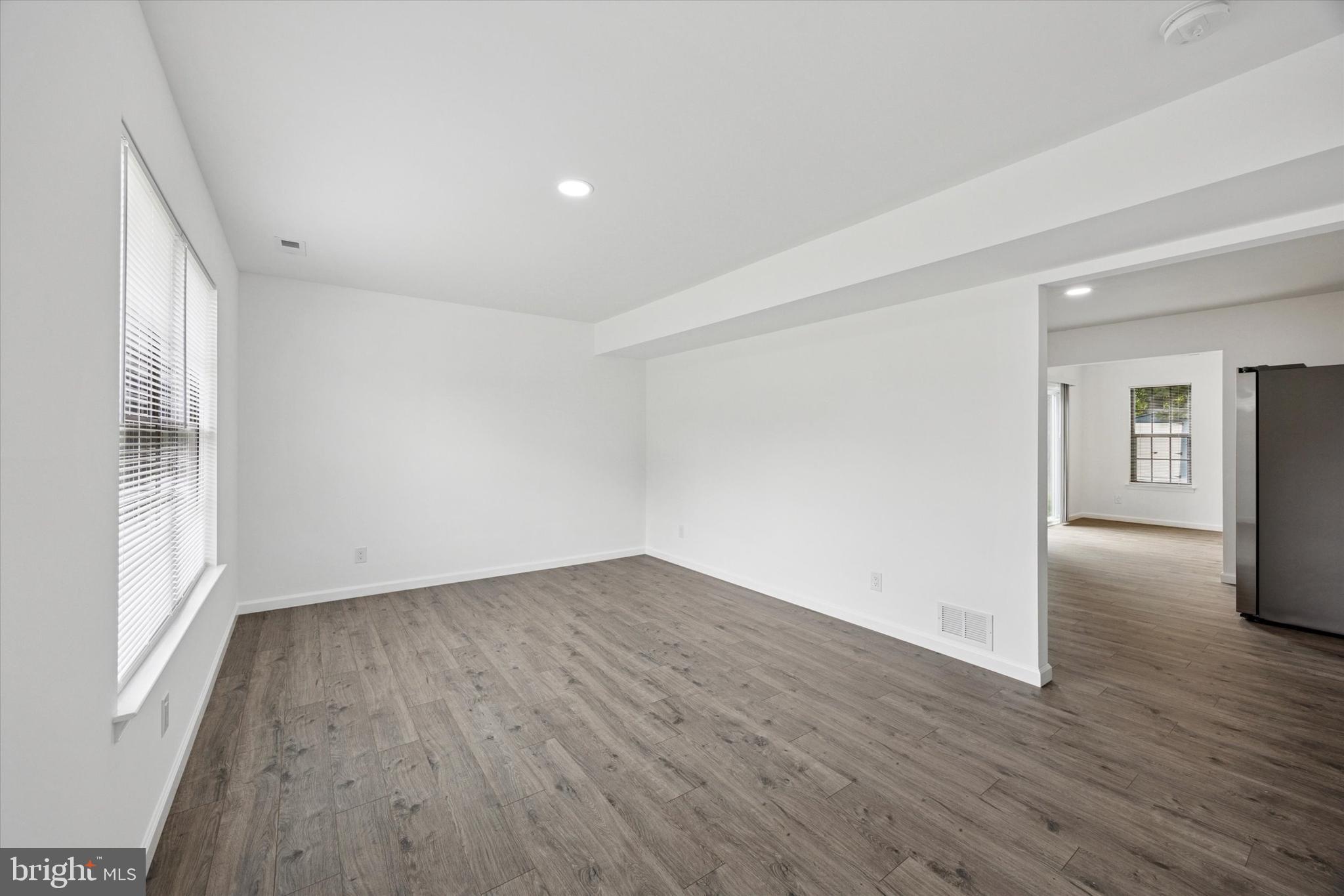 532 Cormorant Drive Voorhees, NJ 08043 - Photo 8 of 25 a view of an empty room with wooden floor and a window