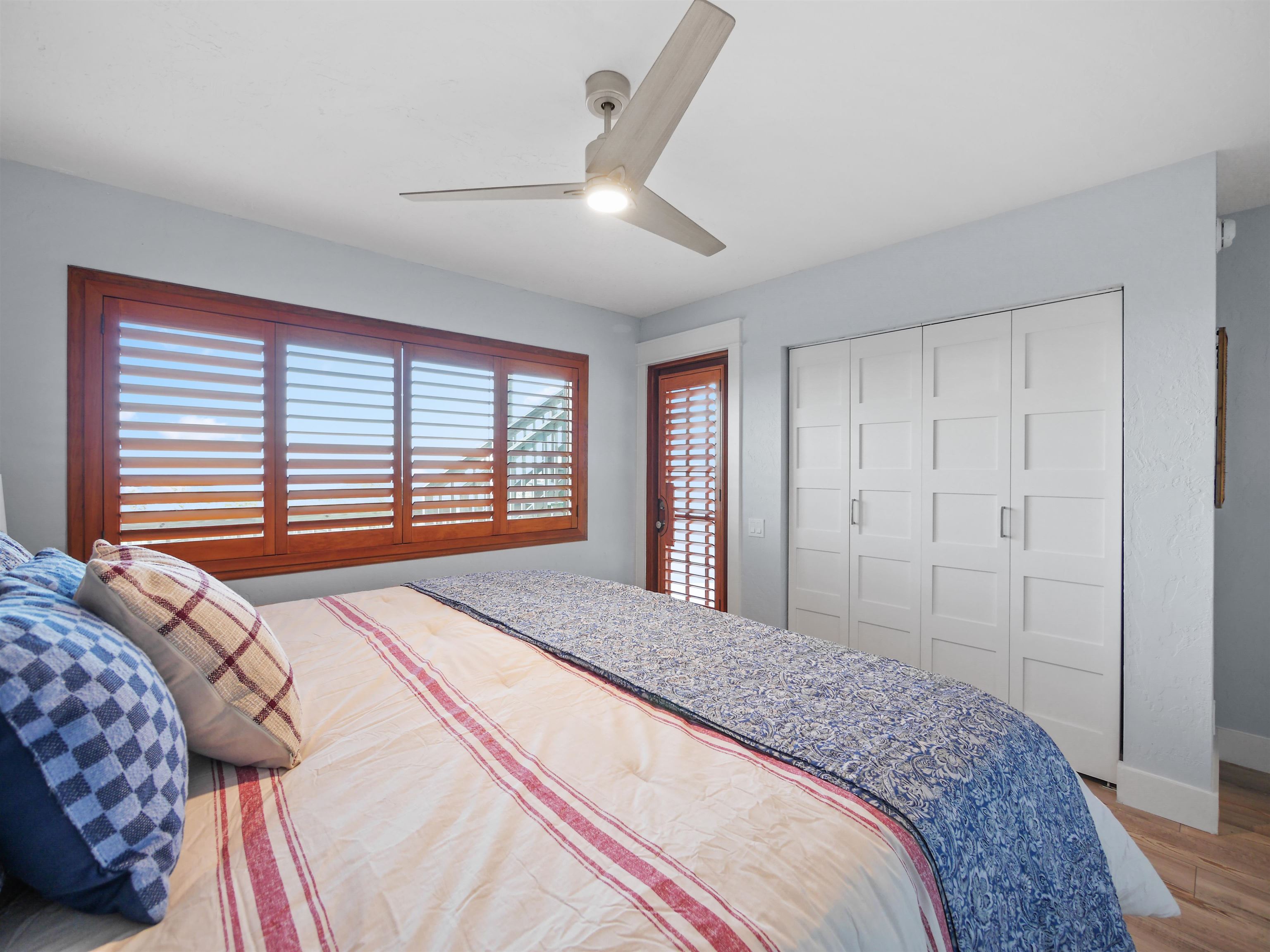 5372 Atlantic View St. Augustine, FL 32080 - Photo 15 of 56 a bedroom with a large bed and a large window