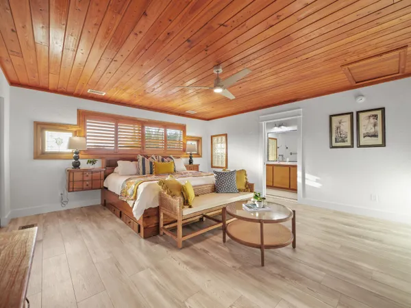 a bed room with furniture and a window