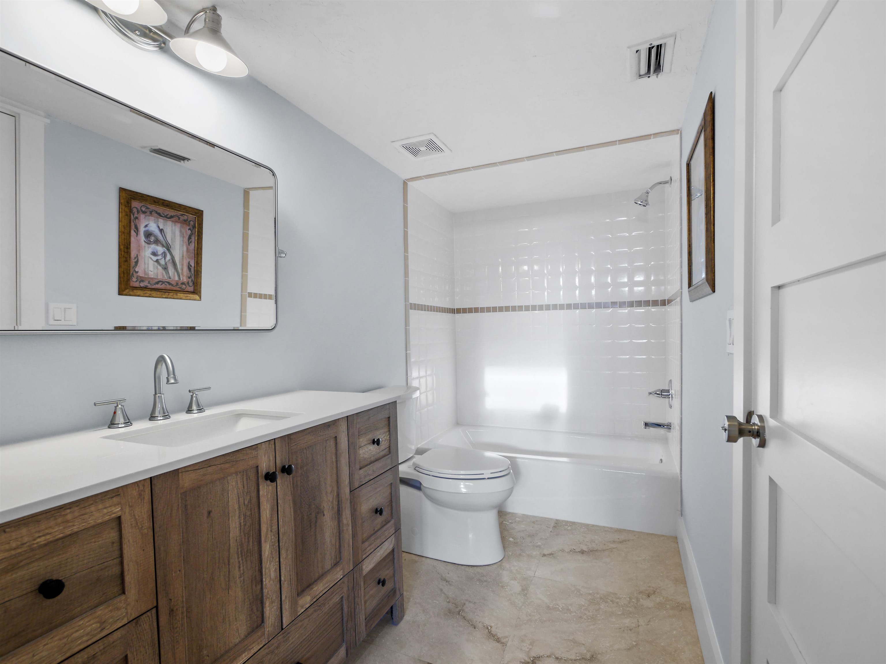 5372 Atlantic View St. Augustine, FL 32080 - Photo 43 of 56 a bathroom with a toilet sink and mirror