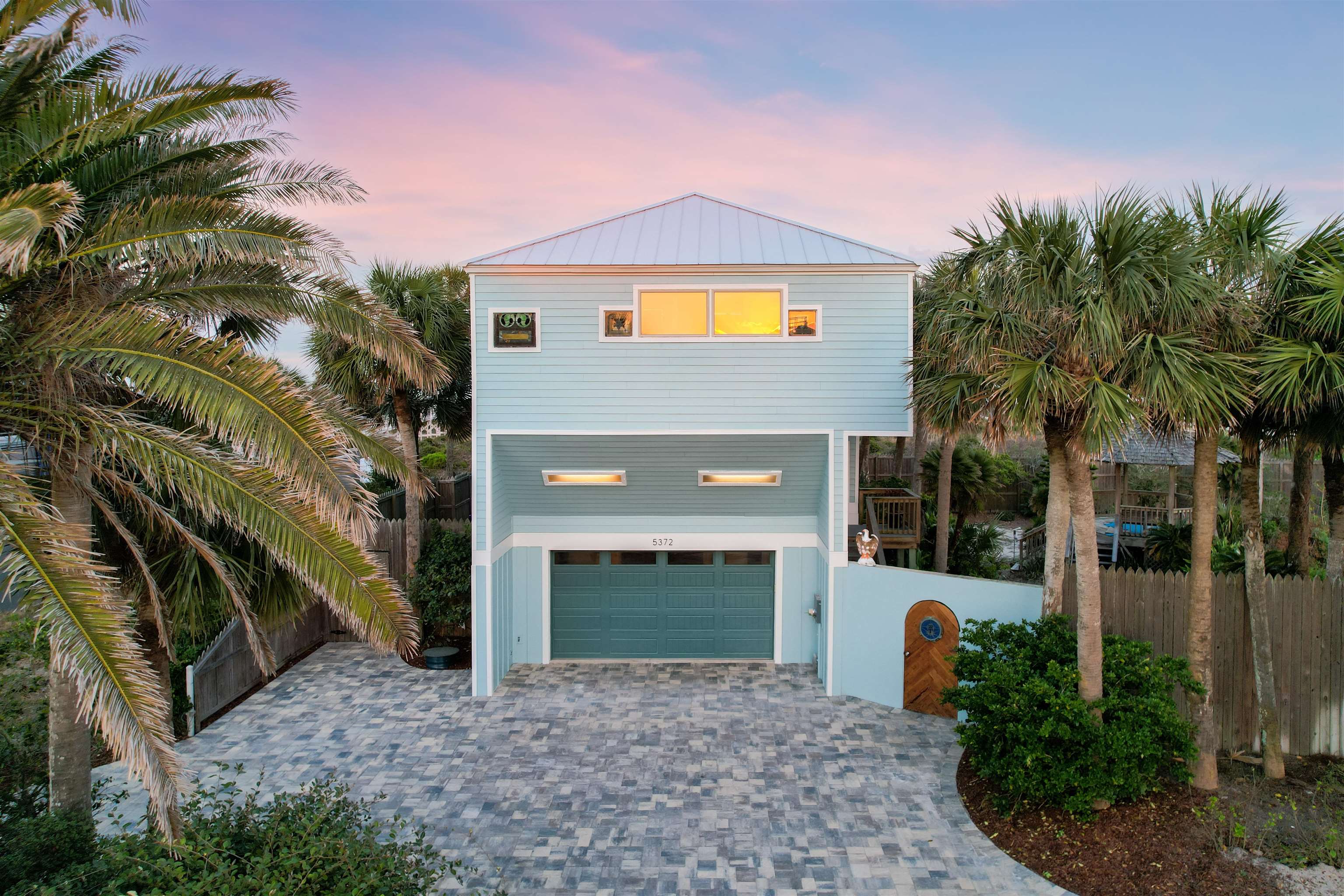 5372 Atlantic View St. Augustine, FL 32080 - Photo 52 of 56 a front view of a house with yard and outdoor seating
