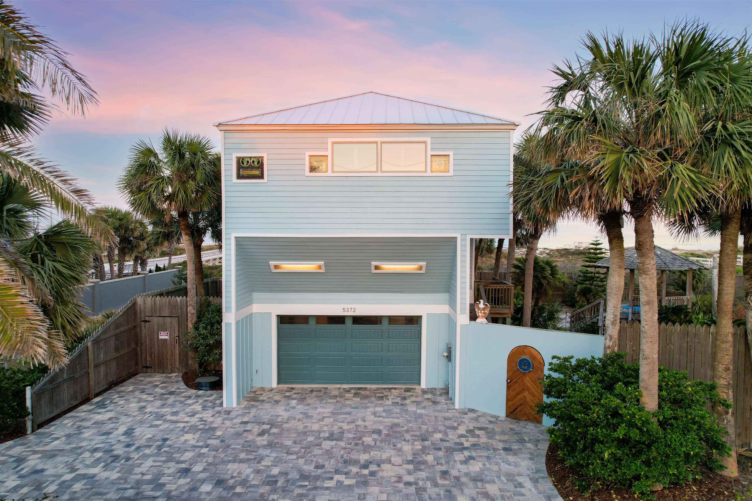 5372 Atlantic View St. Augustine, FL 32080 - Photo 8 of 56 a front view of a house with a garden