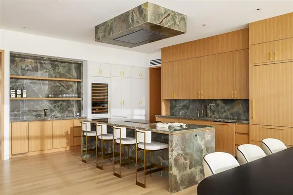 a dining room with furniture and wooden floor