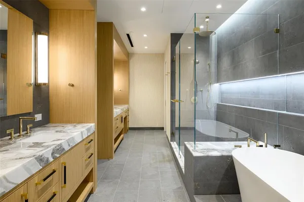 a bathroom with a granite countertop sink mirror and shower