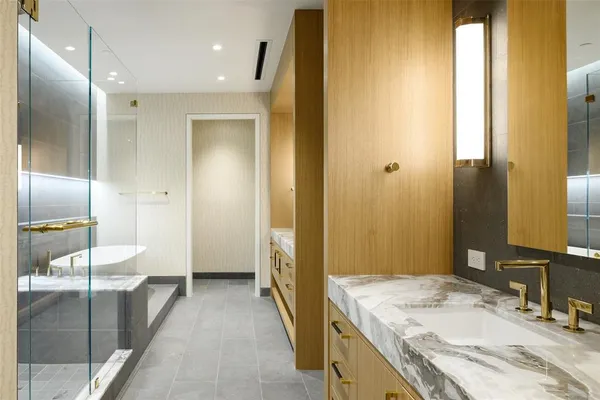 a bathroom with a sink and a mirror