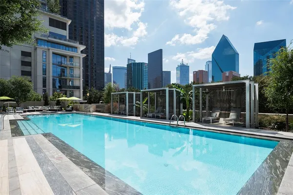a view of a patio with swimming pool table and chairs