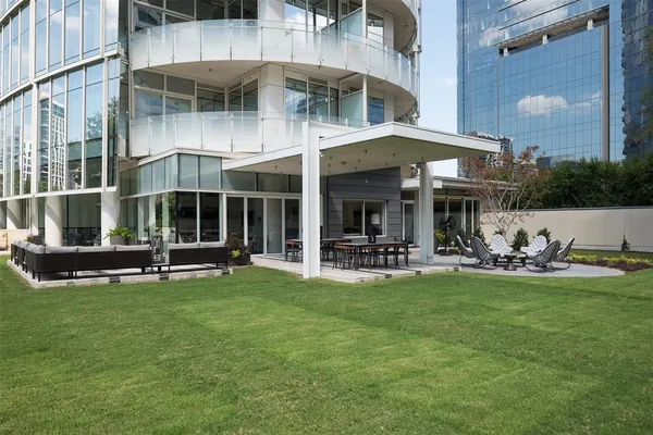a view of a house with sitting area and swimming pool