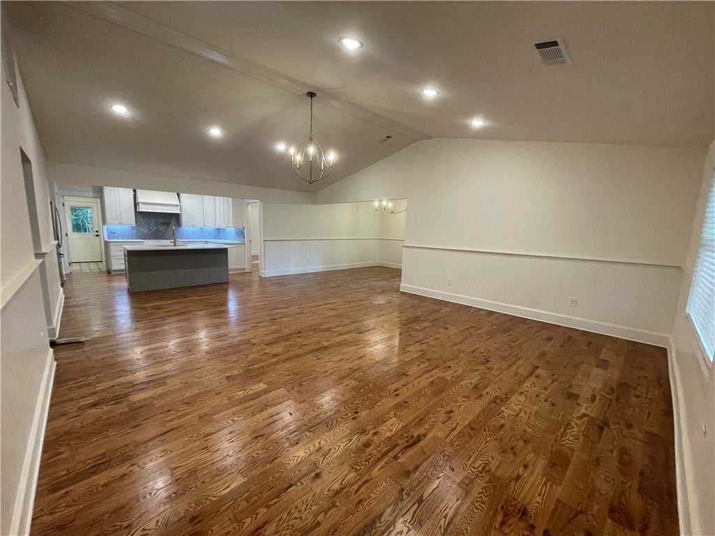 1302 Rocky Brook Road Opelika, AL 36801 - Photo 27 of 37 Living area with real red oak flooring and vaulted ceiling