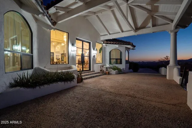 a kitchen with a sink stainless steel appliances and white cabinets