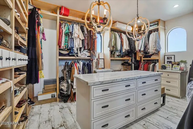 a work room with table chairs and wooden floor