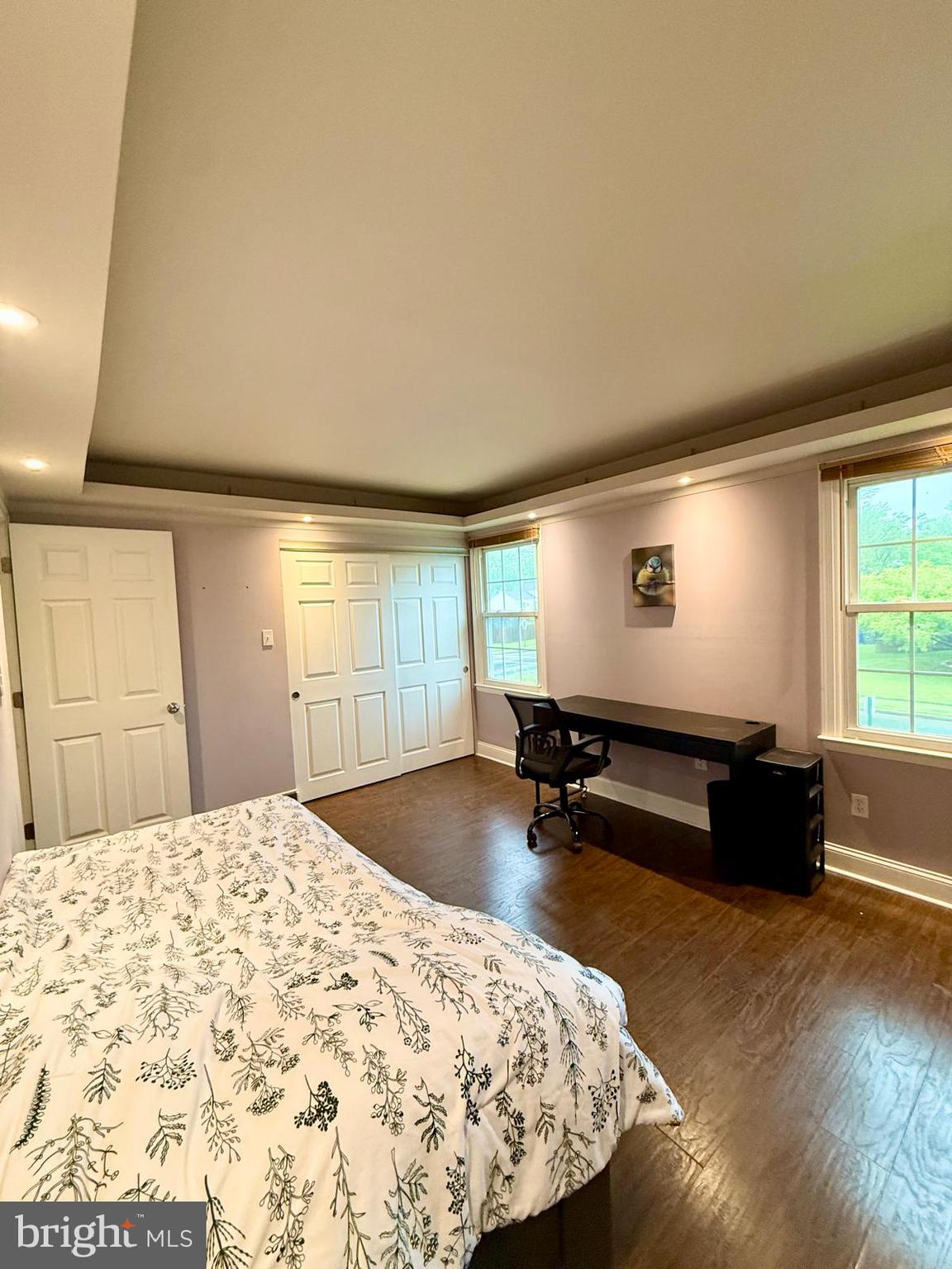1498 Key Parkway Frederick, MD 21702 - Photo 11 of 28 a bedroom with a bed and wooden floor