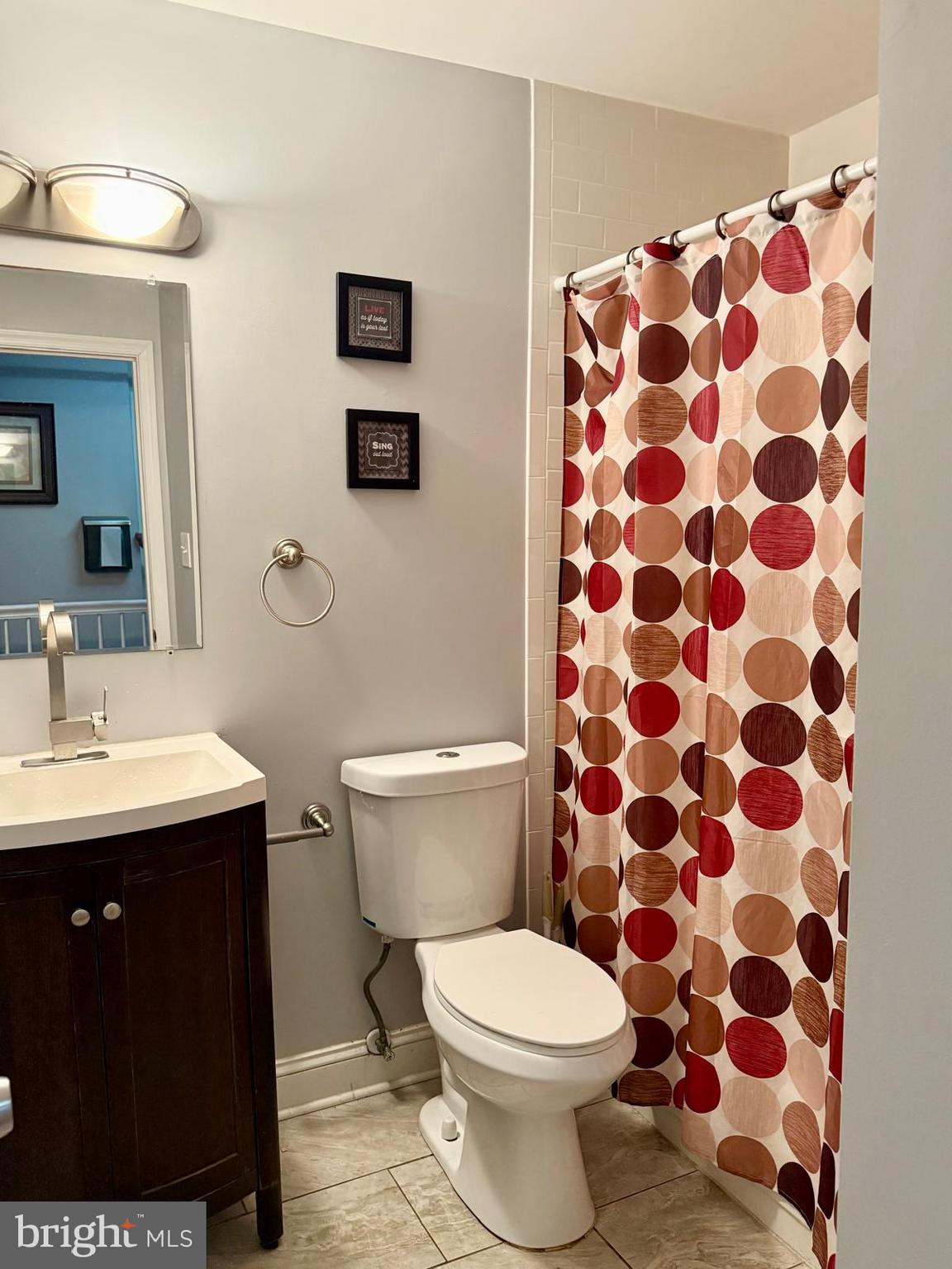 1498 Key Parkway Frederick, MD 21702 - Photo 13 of 28 a bathroom with a sink toilet and shower