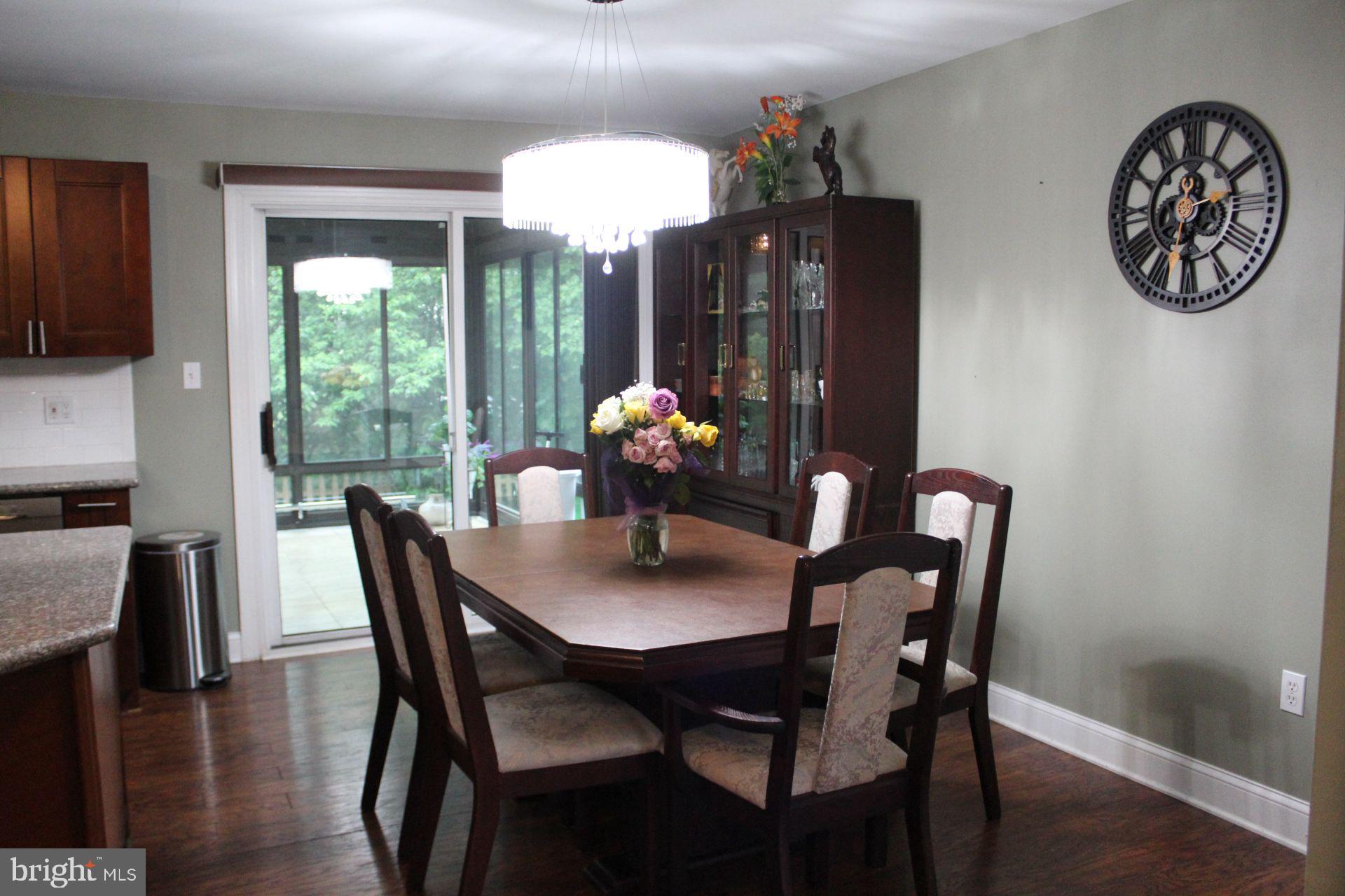 1498 Key Parkway Frederick, MD 21702 - Photo 7 of 28 a dining room with furniture a chandelier and window