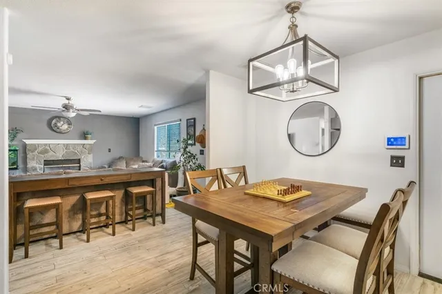 a view of a dining room with furniture and a chandelier