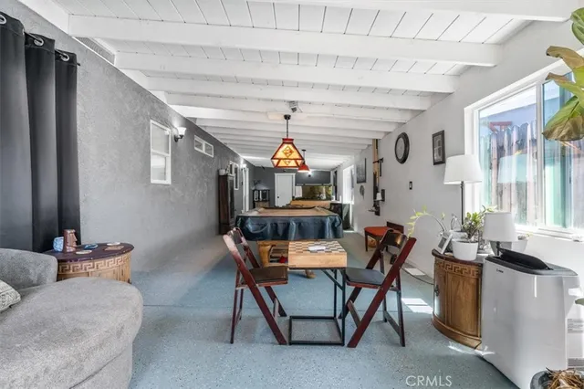 a dining room with furniture and window