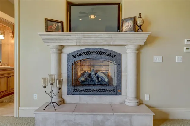 a dining room with furniture a chandelier and wooden floor