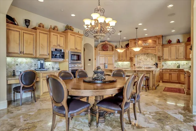 a spacious bedroom with a bed and a fireplace